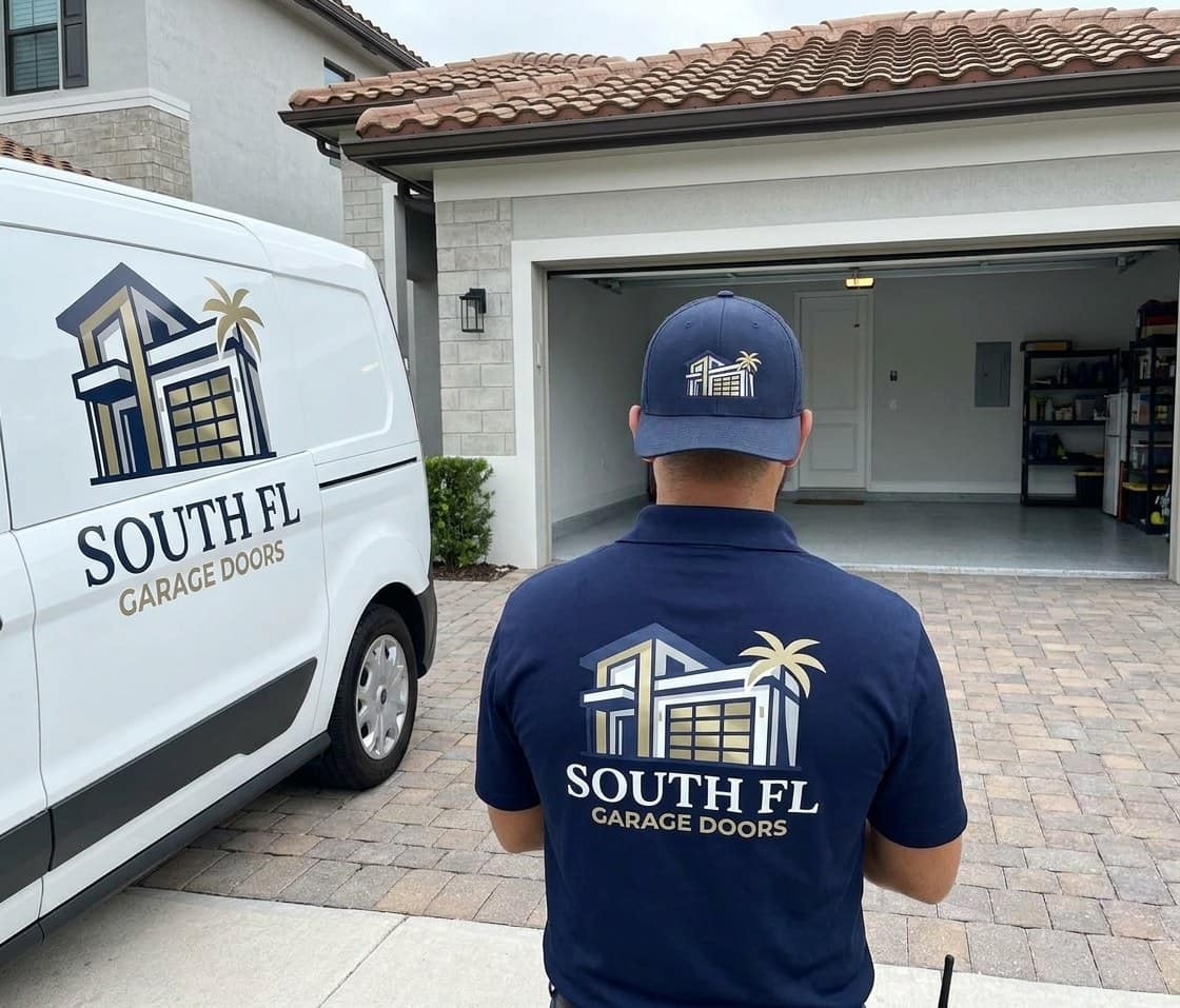 Plain white service van parked at the curb of a Florida home with its cargo light on, the garage lit behind it